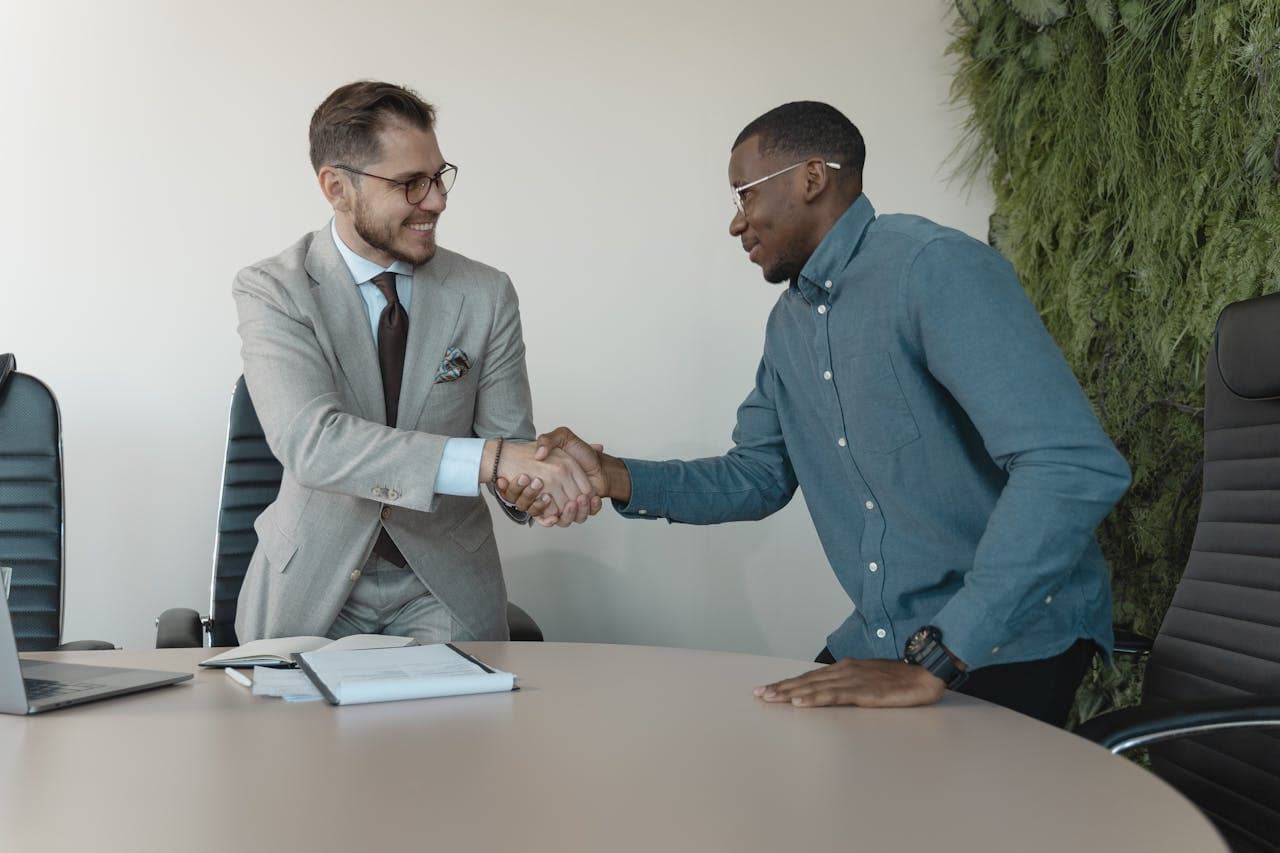 Business professionals shaking hands